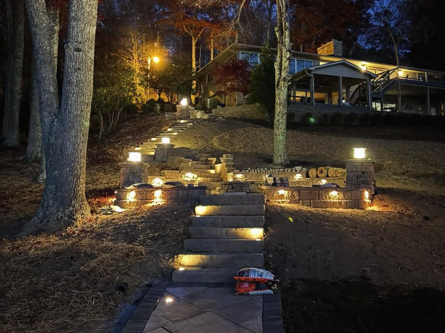 Outdoor lighting: path and step lights along a paver walkway at night