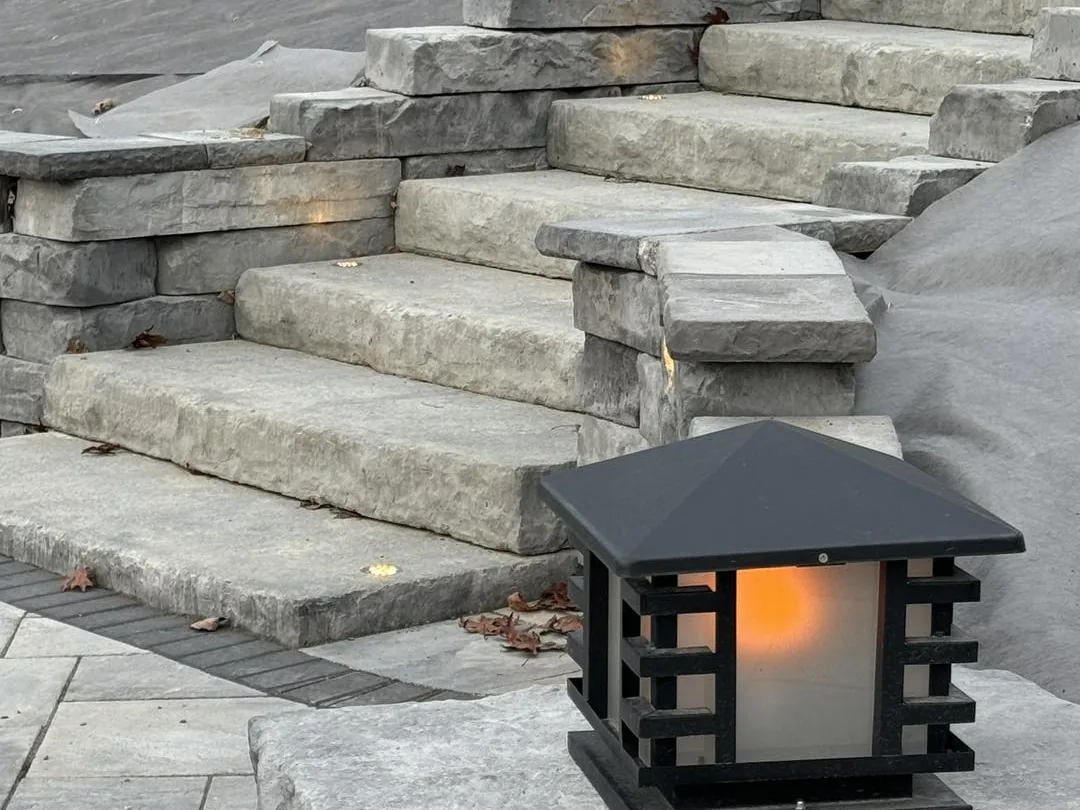 Walkways and steps: stone slab steps with a lantern on the landing